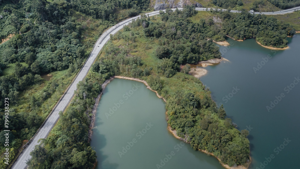 Fototapeta premium Green lake and rainforest tropical trees in Kuala Kubu Bharu, Malaysia.