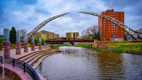 Sioux Falls City Skyline and Big Sioux Riverfront Trail Landscape with water reflections of the bridges in South Dakota, USA