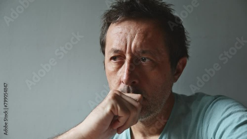 Portrait of solemn pensive mature adult caucasian man photo