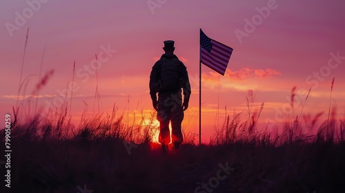Silhouette of a veteran standing alone at sunset, looking at a flag at halfmast in a quiet, reflective moment photo