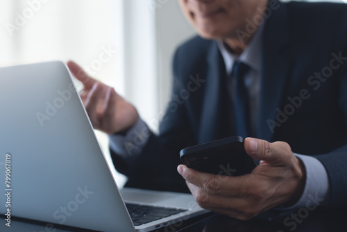 Tableau sur toile Asian businessman online meeting via laptop computer by online meeting app from office, video conference