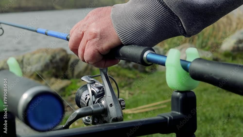 Close up carp fishing rod setup with multiple rods on a stand with alarms set lines near lakeside in early overcast morning. Hobby leisure, angling equipment gear. Fishing reels tackle holders
Close up carp fishing rod setup with multiple rods on a stand with alarms set lines near lakeside in early overcast morning. Hobby leisure, angling equipment gear. Fishing reels tackle holders