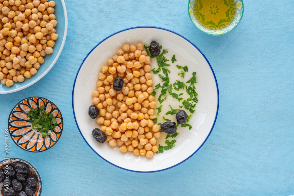 Chickpeas served with black olives, chopped cilantro, olive oil.. Chickpeas served with black olives, chopped cilantro, olive oil..