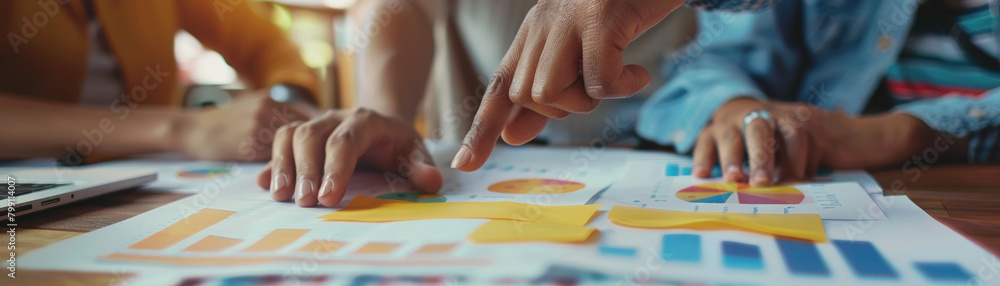 Focused shot of hands pointing at a financial chart during an audit meeting, suggesting collaborative problem solving, Focused shot of hands pointing at a financial chart during an audit meeting, suggesting collaborative problem solving,