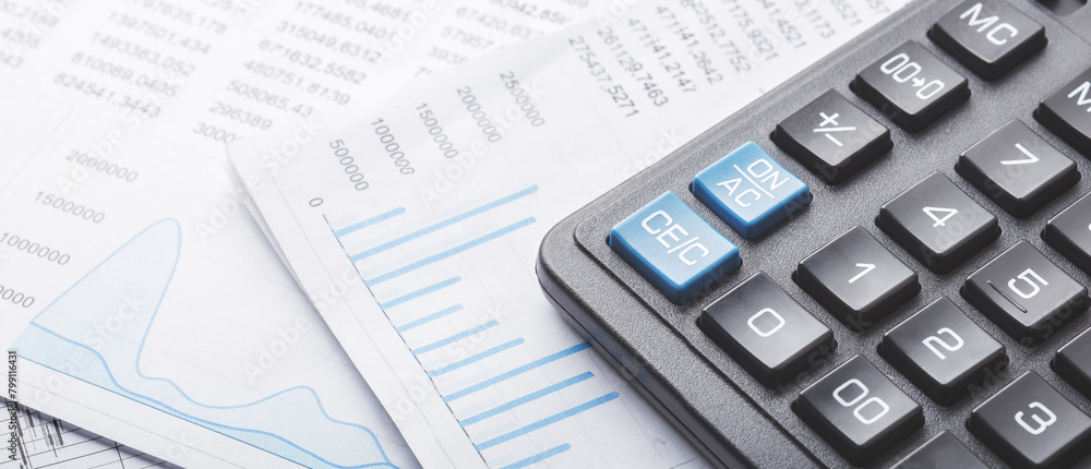 calculator and financial charts. Investment and capital accumulation concept calculator and financial charts. Investment and capital accumulation concept