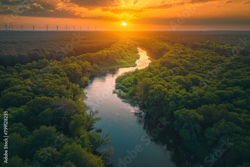 Wallpaper Mural A beautiful sunset over a river with a few wind turbines in the background Torontodigital.ca