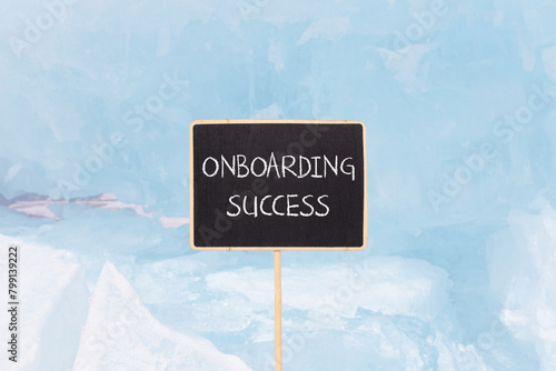 Onboarding success symbol. Concept words Onboarding success on beautiful yellow black blackboard. Beautiful blue ice background. Business onboarding success concept. Copy space.