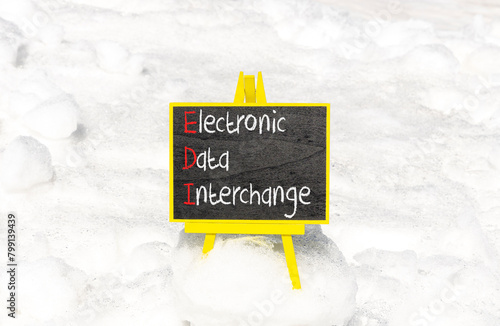 EDI electronic data interchange symbol. Concept words EDI electronic data interchange on blackboard. Beautiful white snow background. Business and EDI electronic data interchange concept. Copy space.