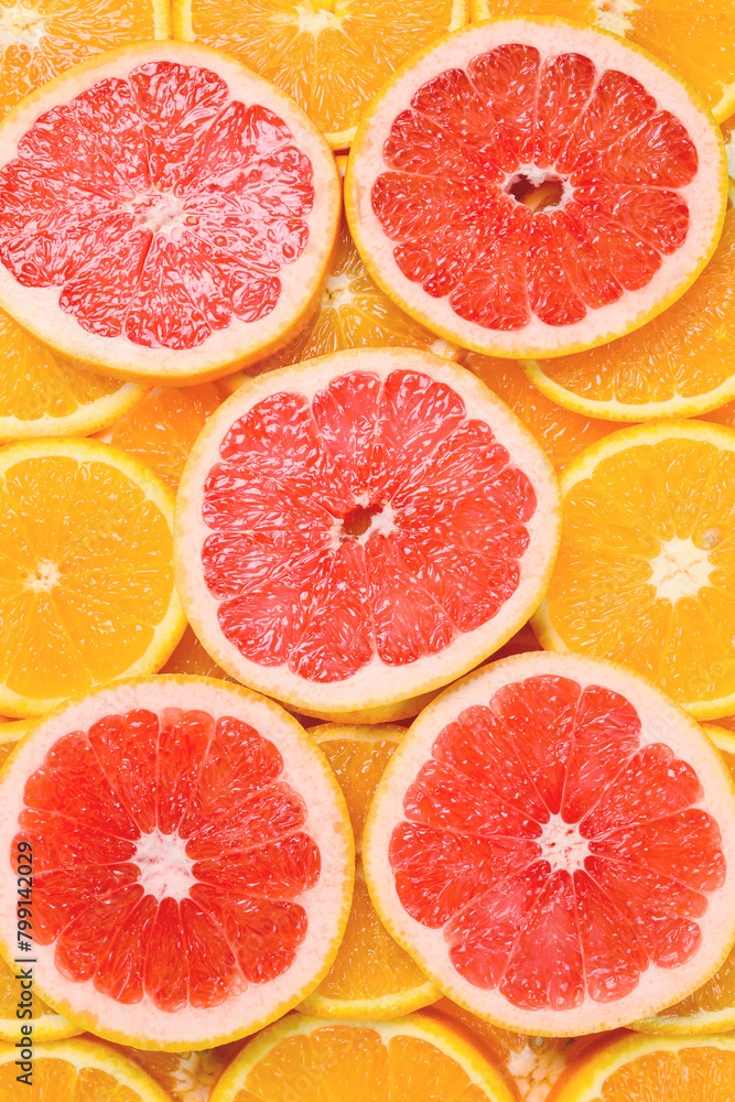 Slices of oranges and a grapefruits as a background. Slices of oranges and a grapefruits as a background.