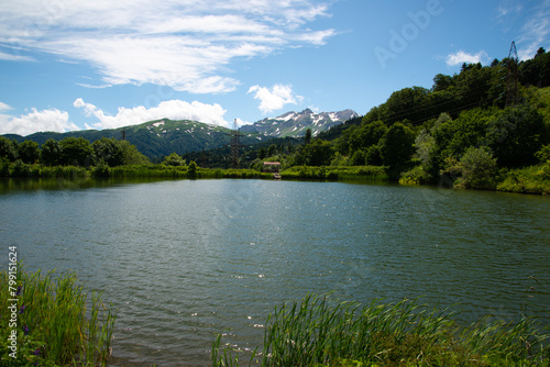 Beautiful mountain landscape in early spring. Cold blue lake.