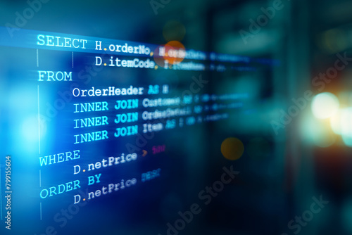 Developer or Programmer's text editor showing SQL Structured Query Language code on computer monitor and server room background. SQL Programming language concept, Computer courses, Training, Learnin.