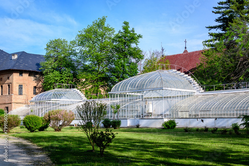 Old historical buiding of a greenhouse at Mogosoaia Palace (Palatul Mogosoaia) near the lake and park, a weekend attraction close to Bucharest, Romania, in a sunny spring day. photo