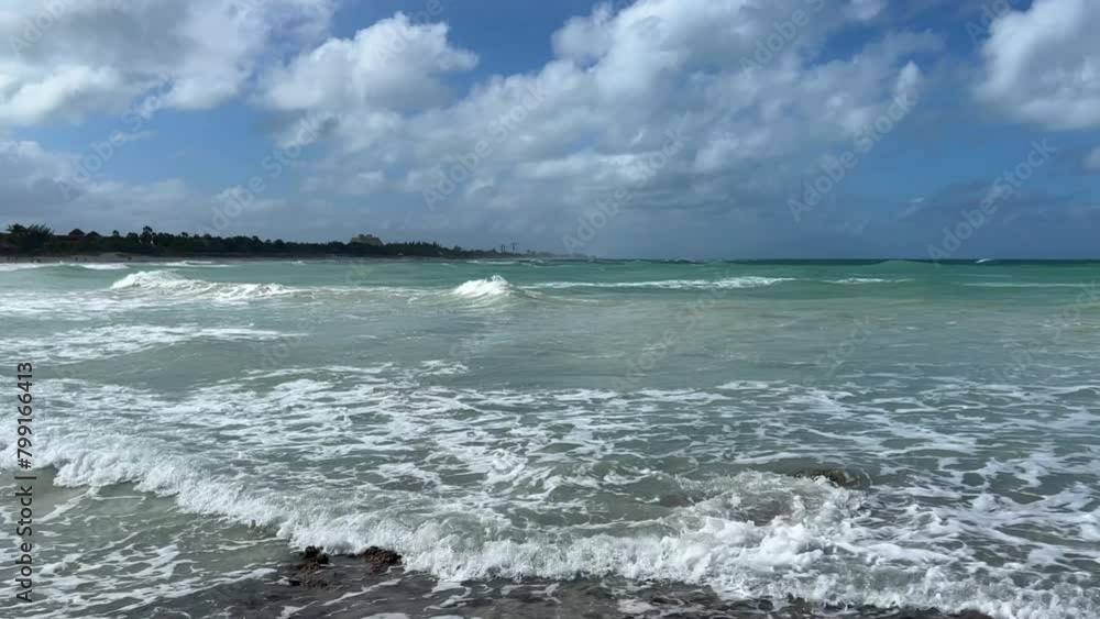 Rocky Cuban beach in Varadero, Cuba, on a cloudy day, when the sun ...