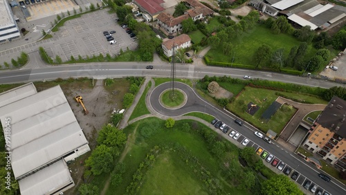 Aerial view of industrial zone. Top view of the city San Giuliano Milanese. Drone view of houses and streets on a spring day. Milan, Lombardy, Italy