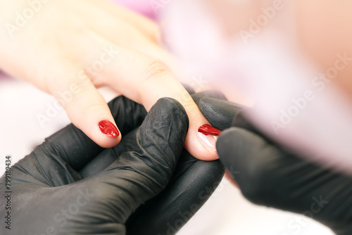 Process of making manicure in salon.