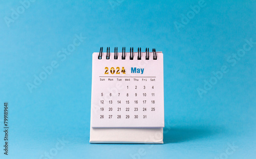Desk calendar for May 2024 on the desktop.