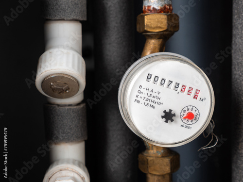 Photos Water meter in box with pipes built into the wall