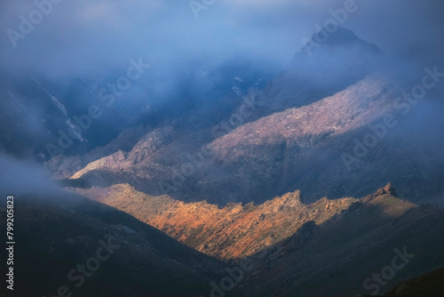 Foggy and pointed dolomite mountains after a thunderstorm, Kelinshektau Mountains in the Karatau massif in Kazakhstan