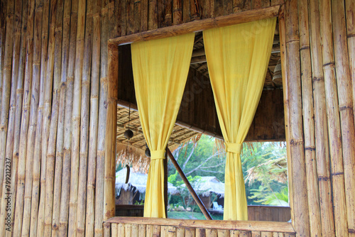 The interior decoration style of the bamboo house is inspired by Asian aesthetics, and it's located near the river at the Canoe Resort. © Ako Kyaw