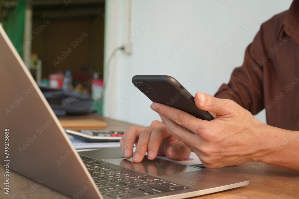 Portrait of Asian male manager working using laptop computer in modern office Male employee sitting at office and using PC See the keyboard typing screen. Enjoy working remotely Portrait of Asian male manager working using laptop computer in modern office Male employee sitting at office and using PC See the keyboard typing screen. Enjoy working remotely