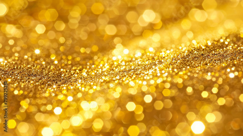 Abstract background of radiant golden glitter with a defocused effect and shimmering texture