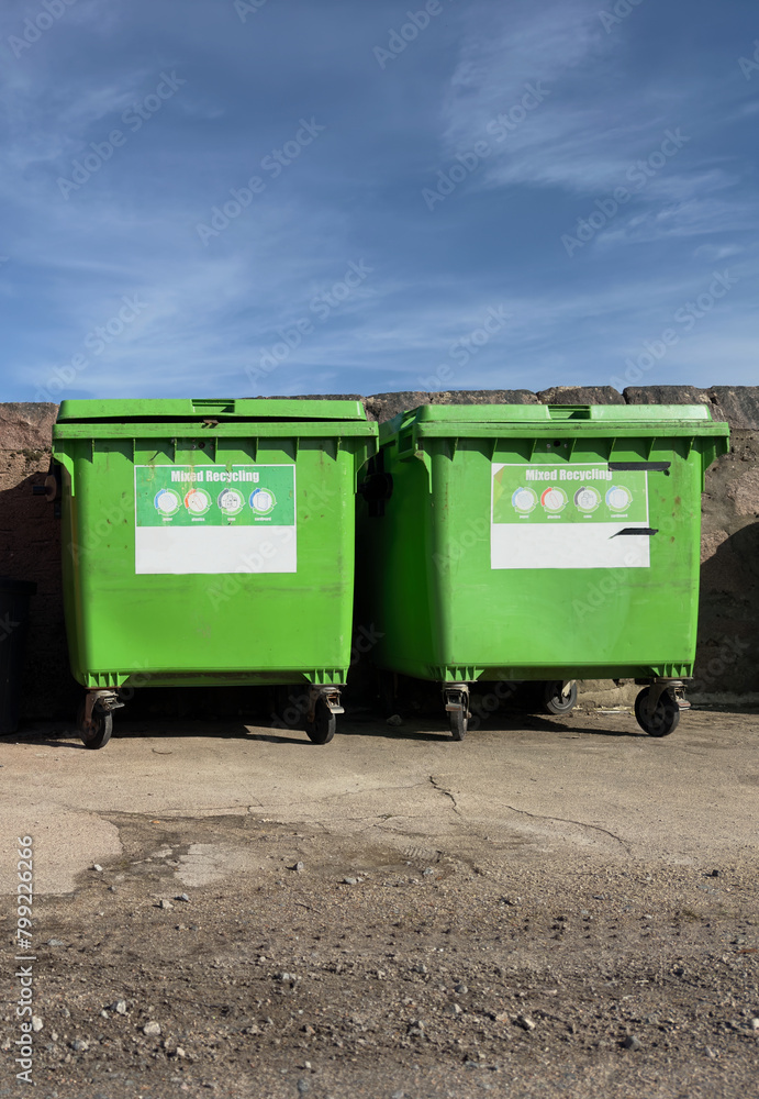 Wheelie bins in row segregated for recycling rubbish Wheelie bins in row segregated for recycling rubbish