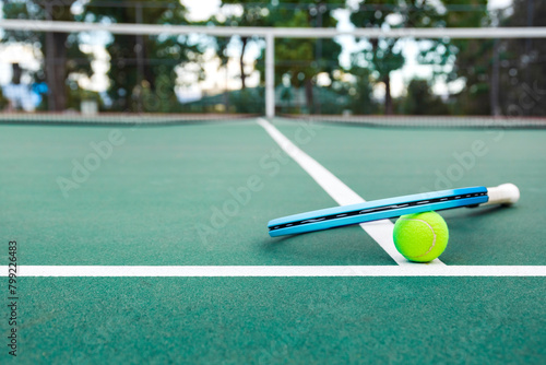 Tennis racket and ball on the court. Close-up. © Mariusz Blach