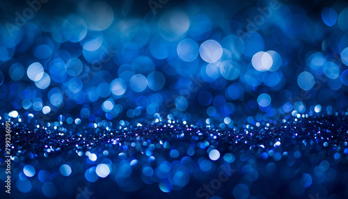 Lapis Lazuli Blue Glitter Defocused Abstract Twinkly Lights Background, sparkling blurred lights in deep lapis lazuli blue hues. photo
