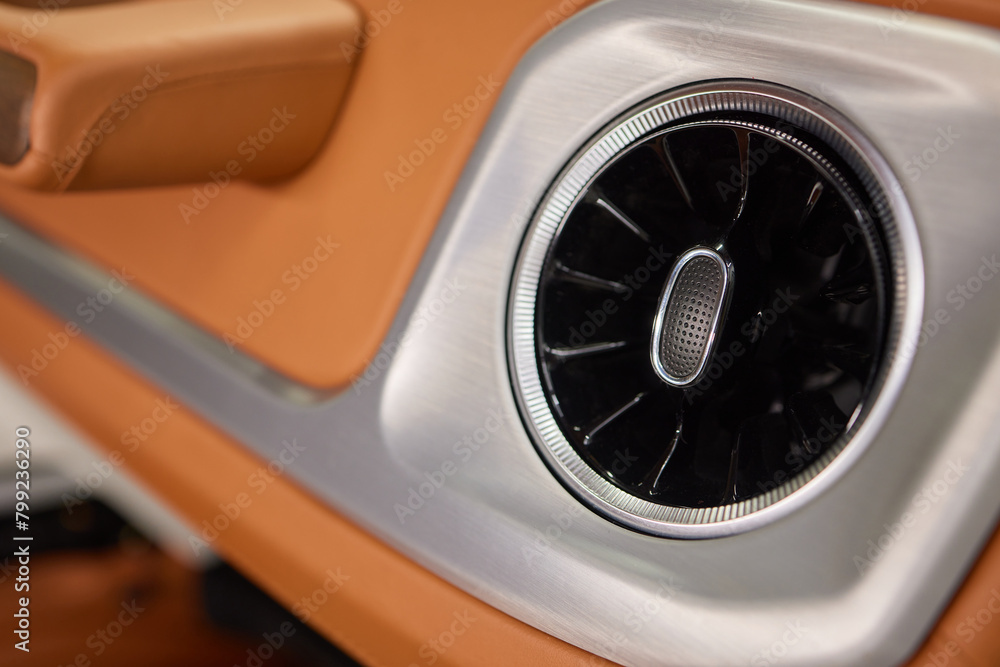 Detailed shot of a vehicle air vent, showcasing automotive design