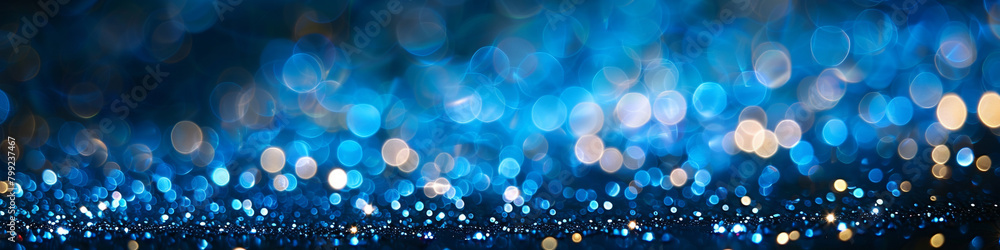 Ocean Blue Glitter Defocused Abstract Twinkly Lights Background, shimmering blurred lights in deep ocean blue tones.