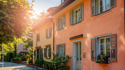 A sunny peach-colored house with traditional windows and shutters basks in the sunlight on a bright day, surrounded by the tranquility of the suburban neighborhood.