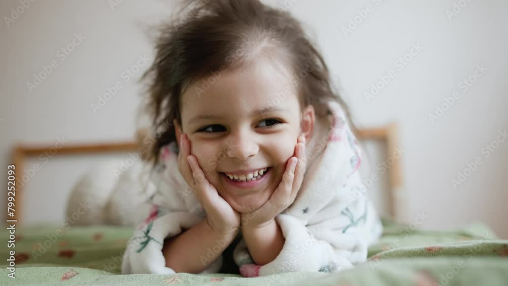 little girl dries her hair with a hair dryer at home. little girl dries her hair with a hair dryer at home.