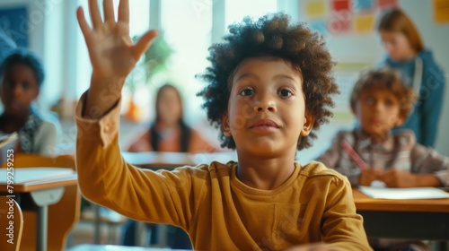 A Boy Raising Hand in Classroom