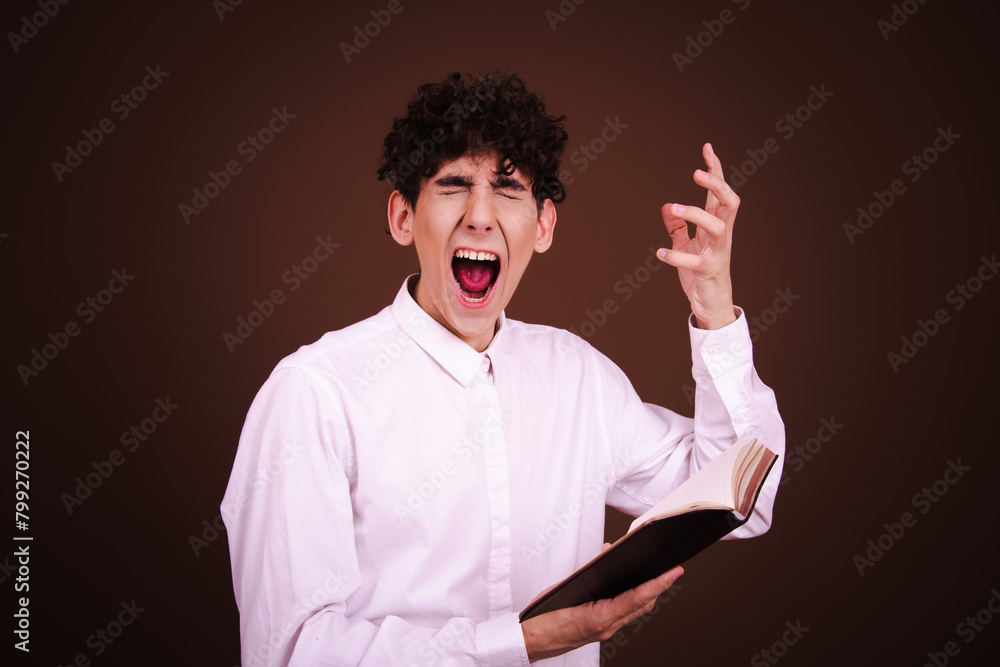 Funny emotional student posing in studio against color background. Funny emotional student posing in studio against color background.
