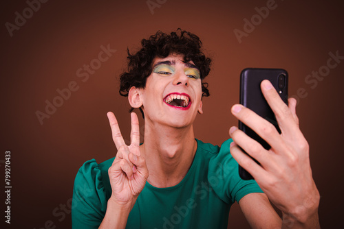 A young attractive guy posing in a photo studio. Funny gay in different situations.