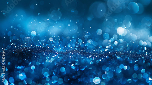 Sapphire-hued particles dance in a mesmerizing display against a blurred environment, stirring the imagination with visions of deep ocean depths.