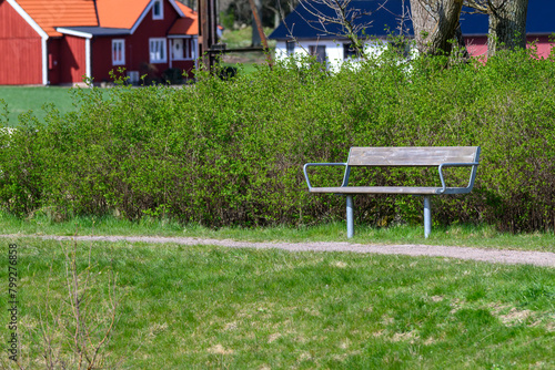 Wooden bench at walkway