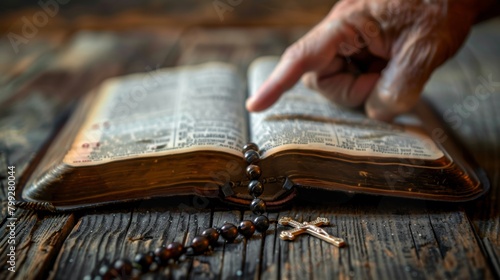 Reading the bible with a rosary cross for prayer, spiritual faith, and holy worship. Closeup of Christian studying religion, gospel prayer books, and praising Jesus. photo