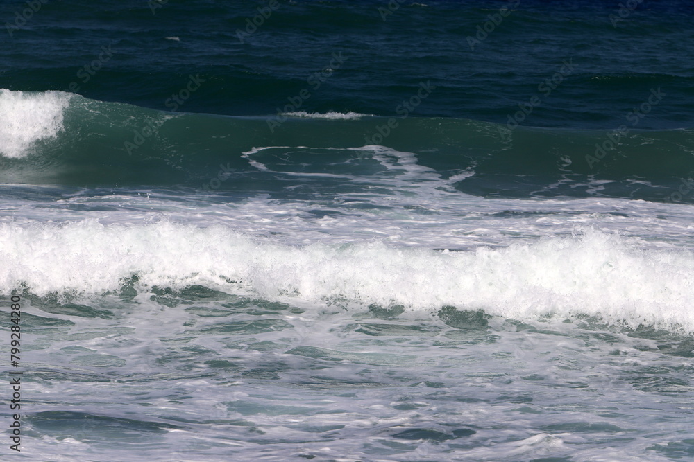 Fototapeta premium The color of water in the Mediterranean Sea in shallow water. Natural abstract background.
