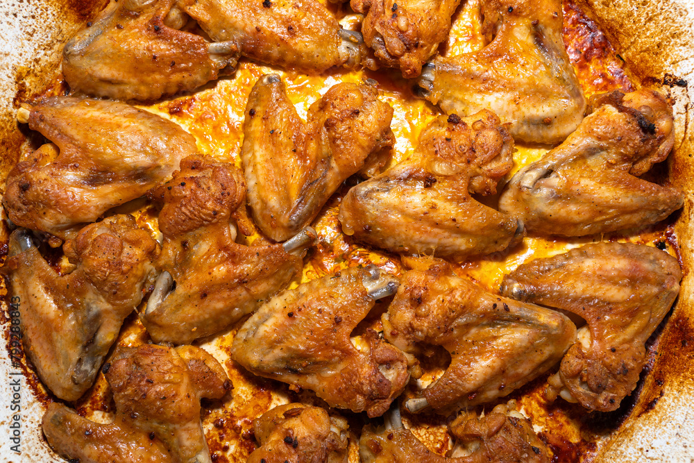 Grilled chicken wings in a baking sheet Grilled chicken wings in a baking sheet