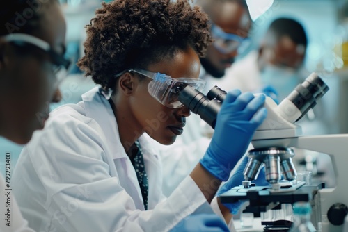 Microscope, scientific, and female pharmaceutical lab scientist studying medicine. African woman chemical researcher using biotechnology equipment.