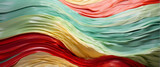 Wavy pattern with a vibrant blend of red, green, and yellow tones resembling layered geological formations or textile