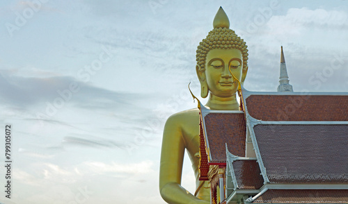 golden buddha statue near chao praya river in bangkok photo