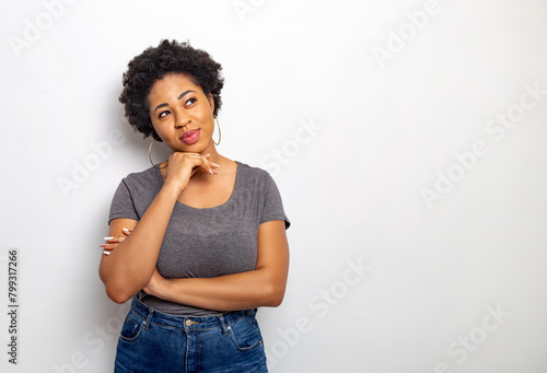 Portrait of a thinking African young woman. Thoughtful woman. Idea concept.