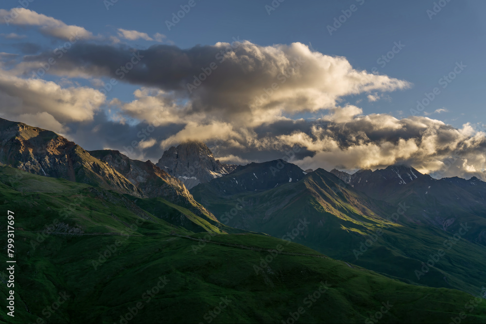 Obraz premium Sunset in mountains and clouds
