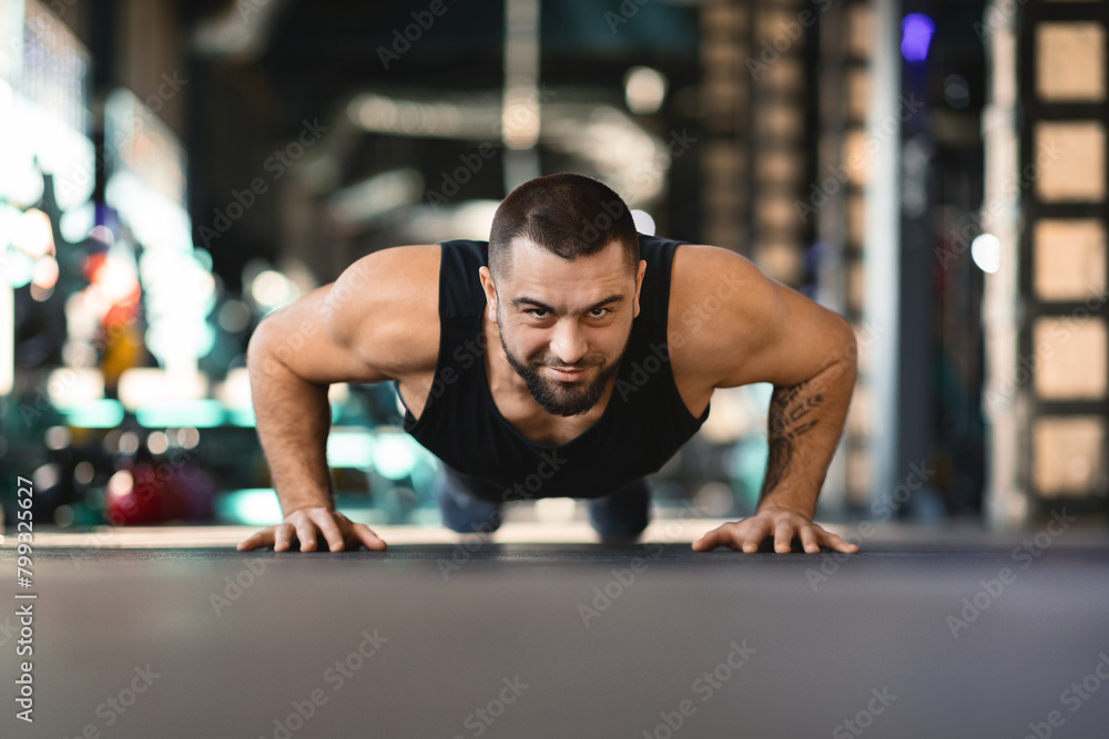 Man Doing Push Ups in a Gym Man Doing Push Ups in a Gym