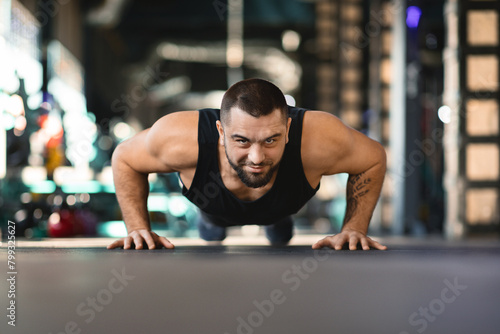 Man Doing Push Ups in a Gym