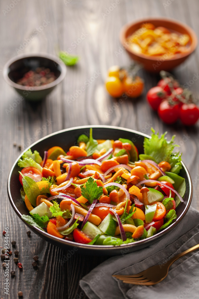 Easy vegetarian salad of fresh cucumber, mushrooms, tomato, sweet pepper and onion in bowl . Healthy vegan food. Easy vegetarian salad of fresh cucumber, mushrooms, tomato, sweet pepper and onion in bowl . Healthy vegan food.
