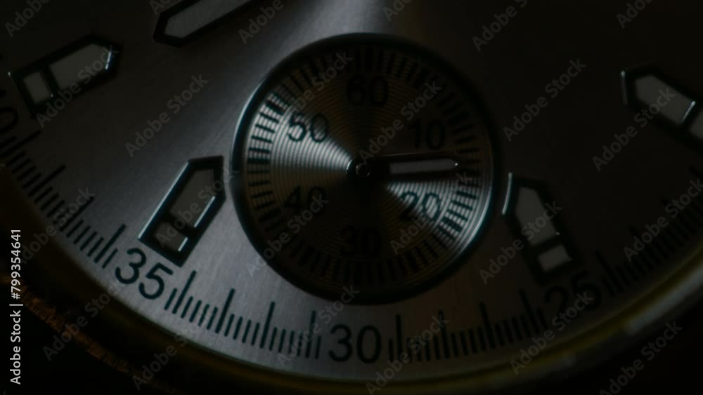 Extreme closeup metallic second arrow passing by on clock face. background for copy space. macro watch Extreme closeup metallic second arrow passing by on clock face. background for copy space. macro watch