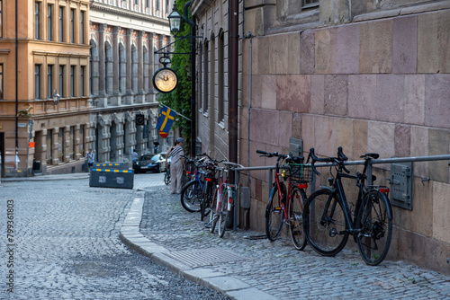 Photography Traditional colorful building, paved street, parked bike in Stockholm, Gamla Stan Old Town, Sweden